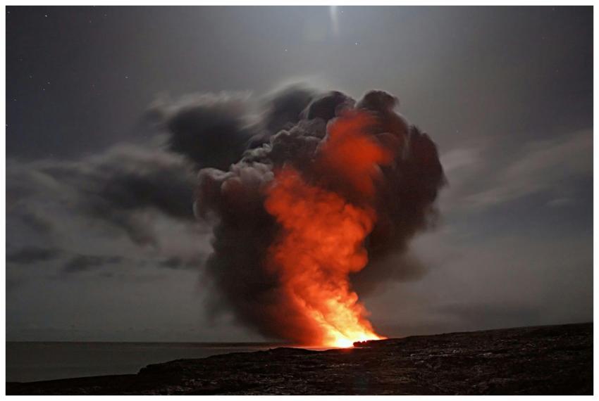 Volcanic eruption with smoke and lava under a star