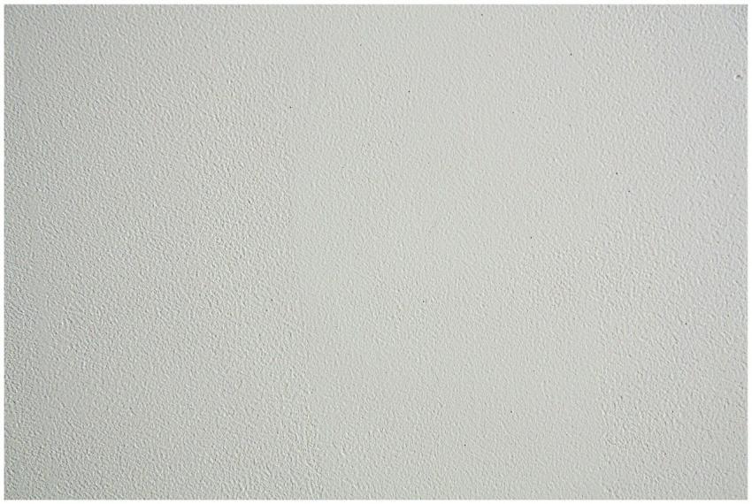 Close-up of a textured white wall, ideal for backg