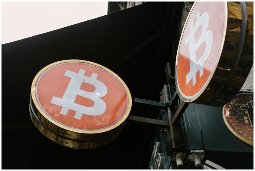 Close-up view of outdoor bitcoin symbol signs, ref