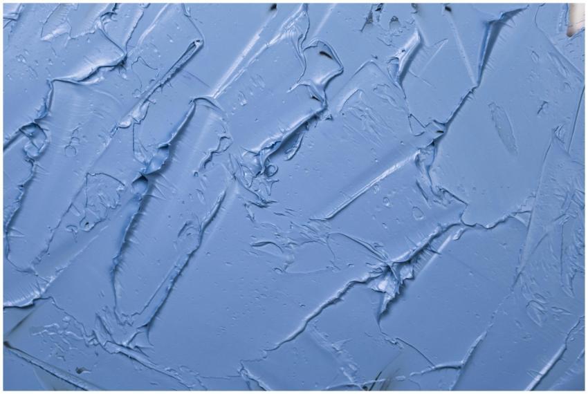 Textured blue paint background showcasing abstract