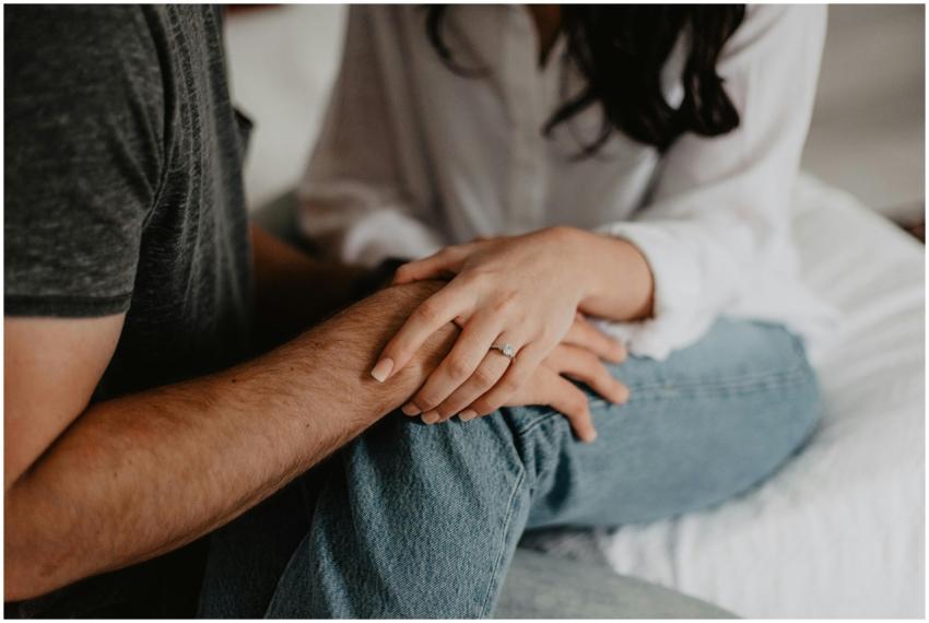 A tender moment of a couple holding hands, symboli