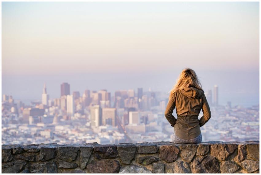 A woman overlooks the stunning skyline of San Fran