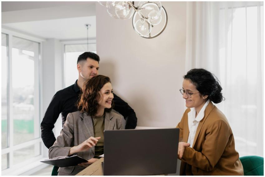 Professional real estate discussion in modern offi