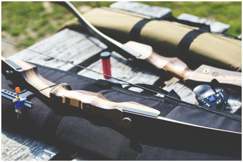 Close-up of archery equipment on a wooden table ou