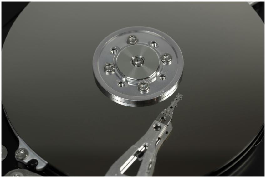 Detailed macro shot of hard drive platters and arm