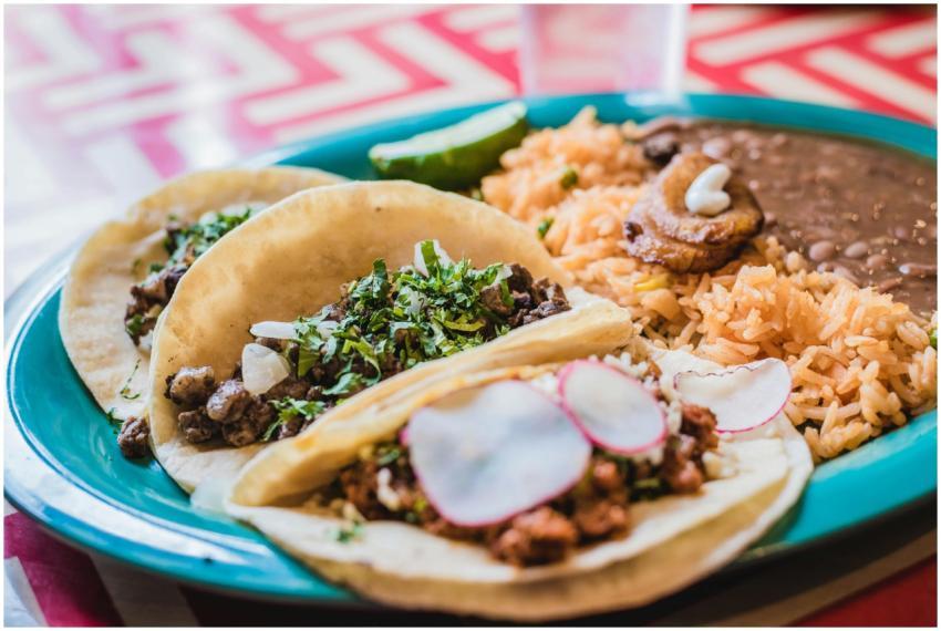 Close-up of delicious Mexican tacos with beans and