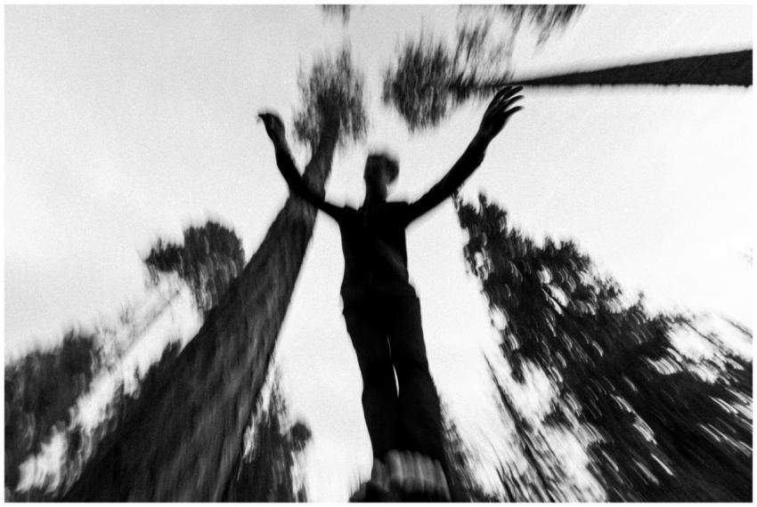 Artistic black and white photo of a person jumping