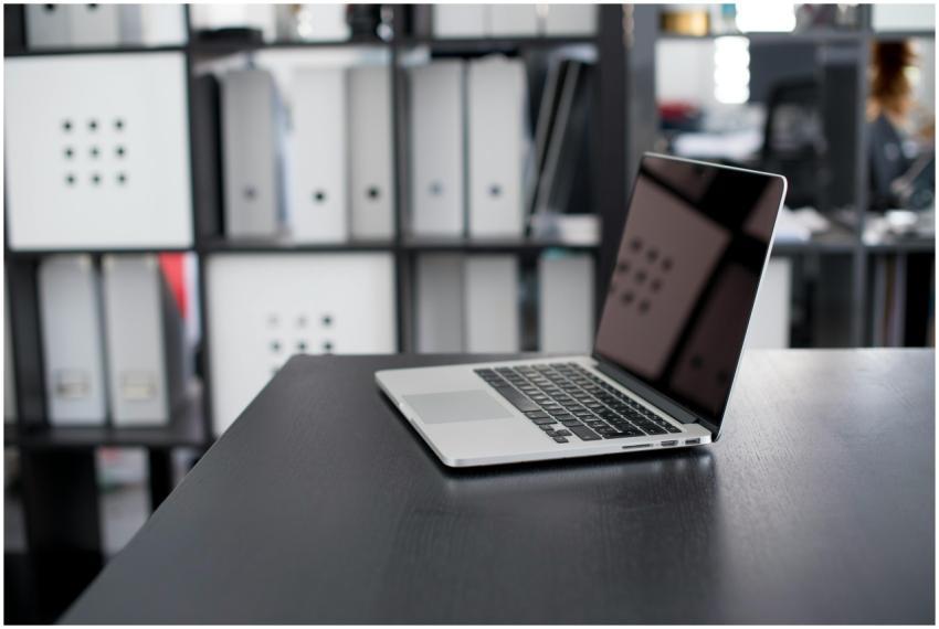 MacBook Pro displayed on a minimalist office desk