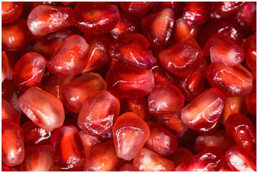 Vivid macro shot of fresh, red pomegranate seeds s