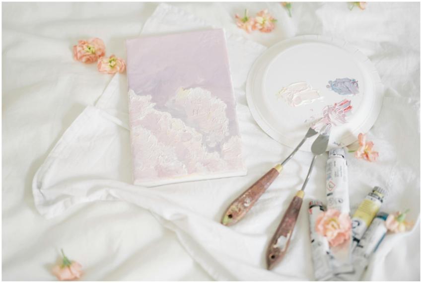 A delicate art setup featuring palette knives, pai