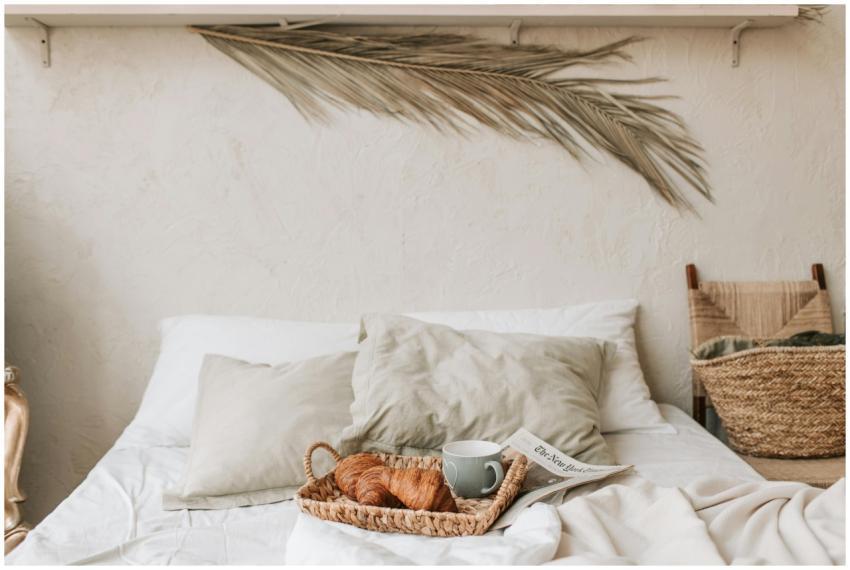 Warm and cozy bedroom with a breakfast tray and cr