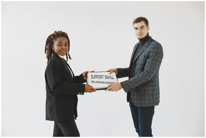 Two diverse business professionals promoting small