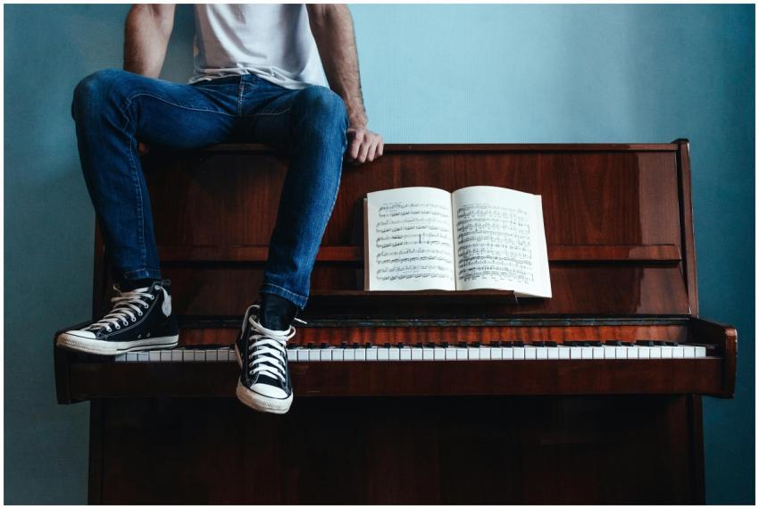 Crop unrecognizable male in trendy gumshoes and je