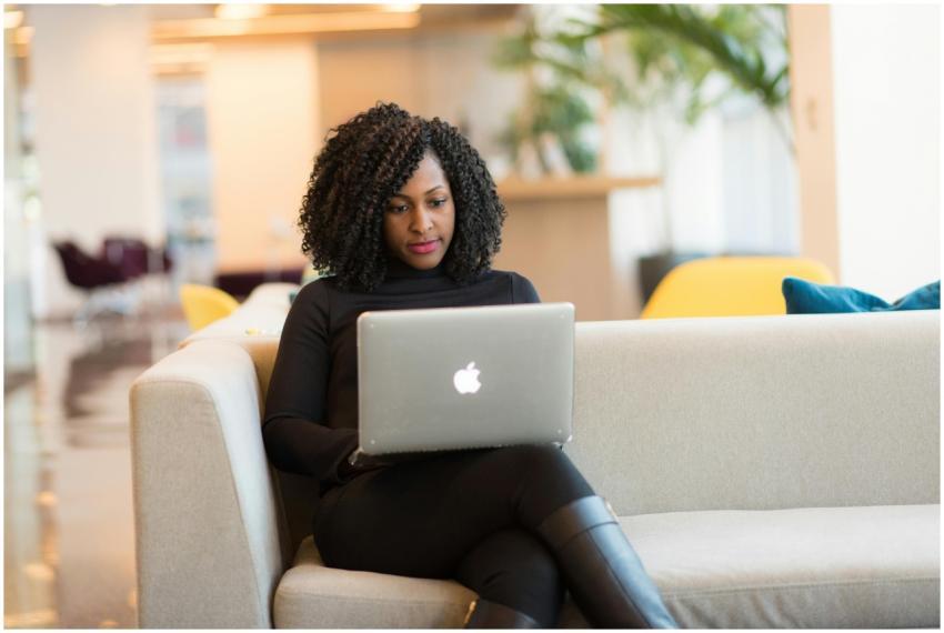 An African American woman working remotely on a la