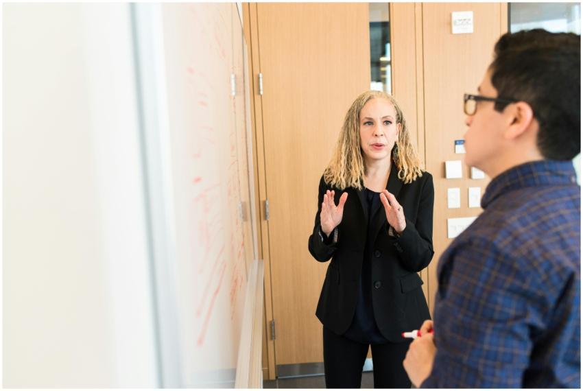 Two professionals discussing ideas at a workplace