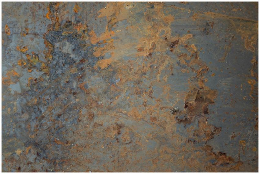 Textured background of aged shabby blue wall with