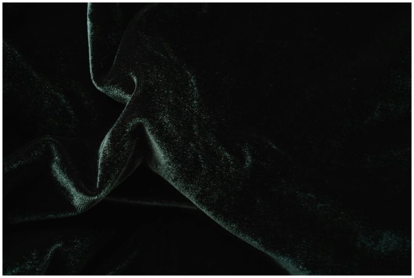 Closeup of a glistening dark velvet fabric showcas