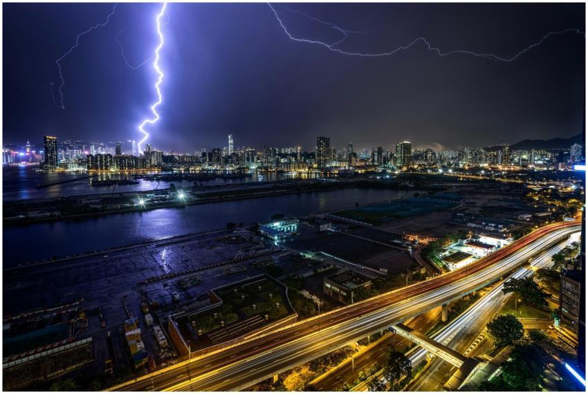 A stunning cityscape at night with a dramatic ligh