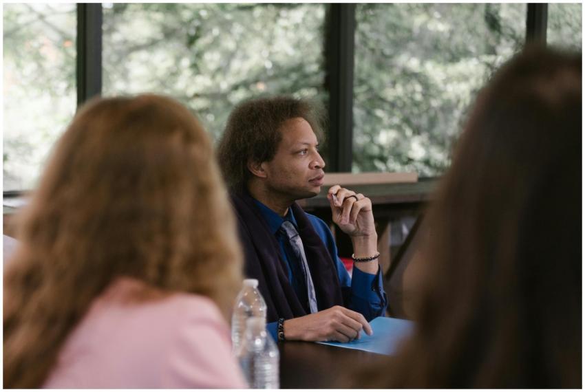 Business professionals engaged in a thoughtful mee