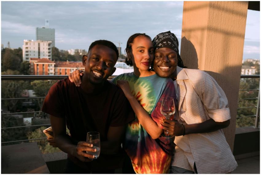 A group of friends enjoying drinks on a rooftop te