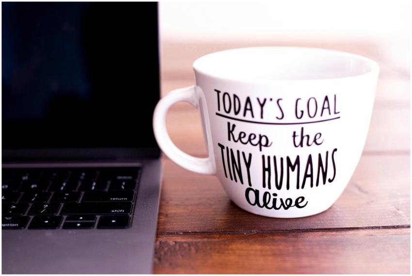 Close-up of a mug with motivational text beside a