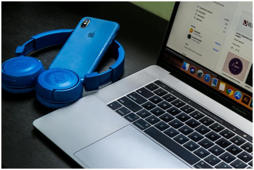 A sleek office setup featuring a laptop, blue head