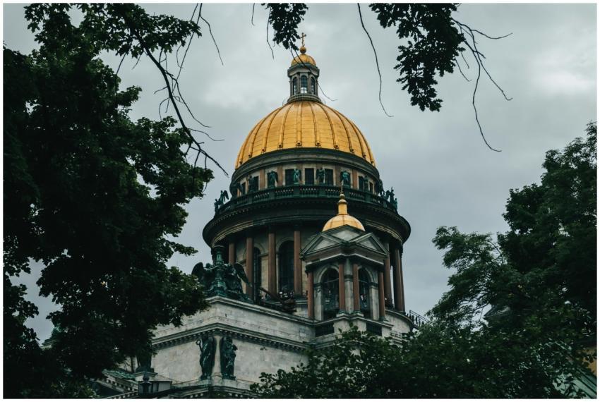 Saint Isaac's Cathedral dome through trees in Sain