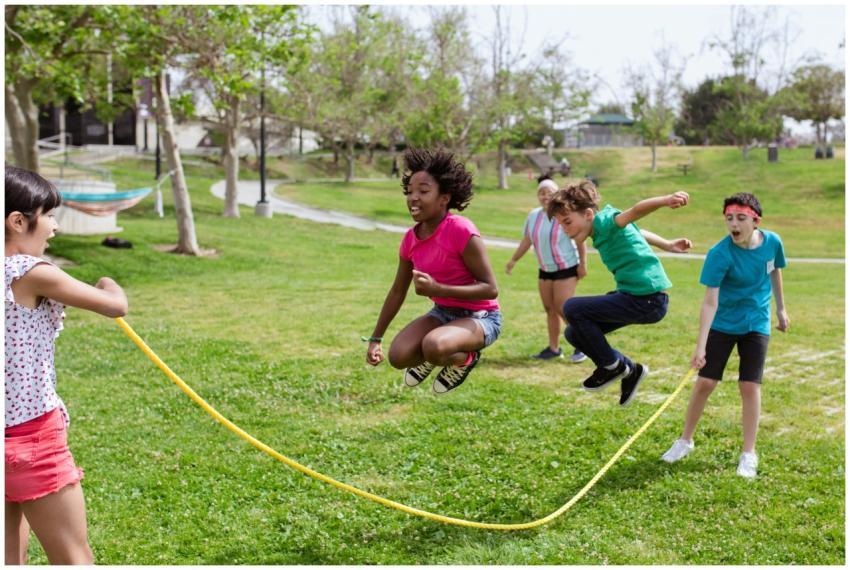 Children enjoying a vibrant day playing jump rope