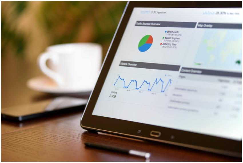 Close-up of a tablet displaying analytics charts o