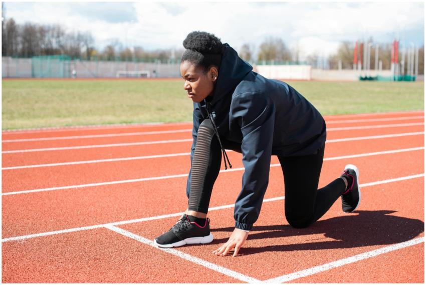 Determined young woman in activewear getting ready