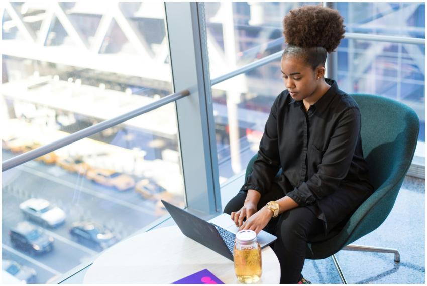 African American woman working on a laptop in a mo