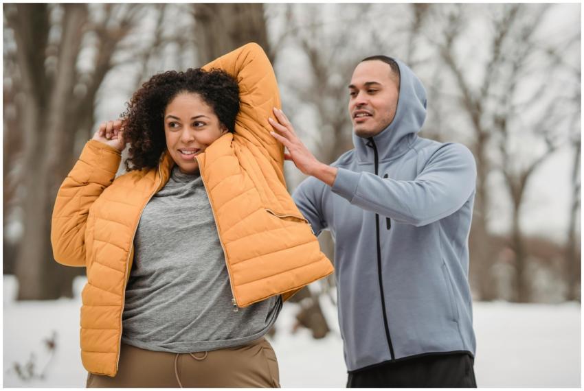 A man and a woman engaging in a winter workout in