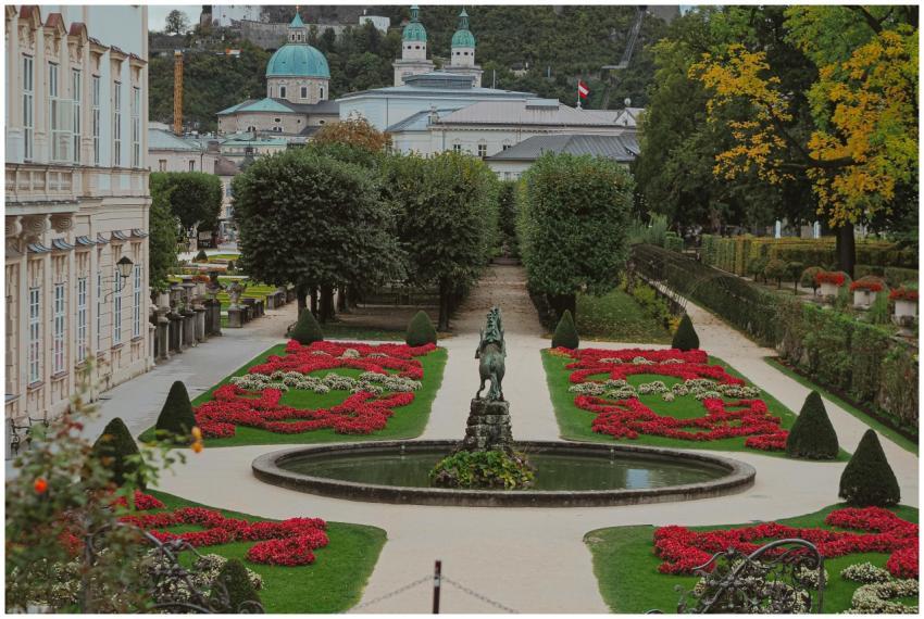 Beautiful view of Mirabell Gardens with Salzburg C