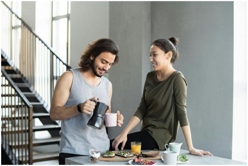 A couple enjoy a casual breakfast indoors with cof