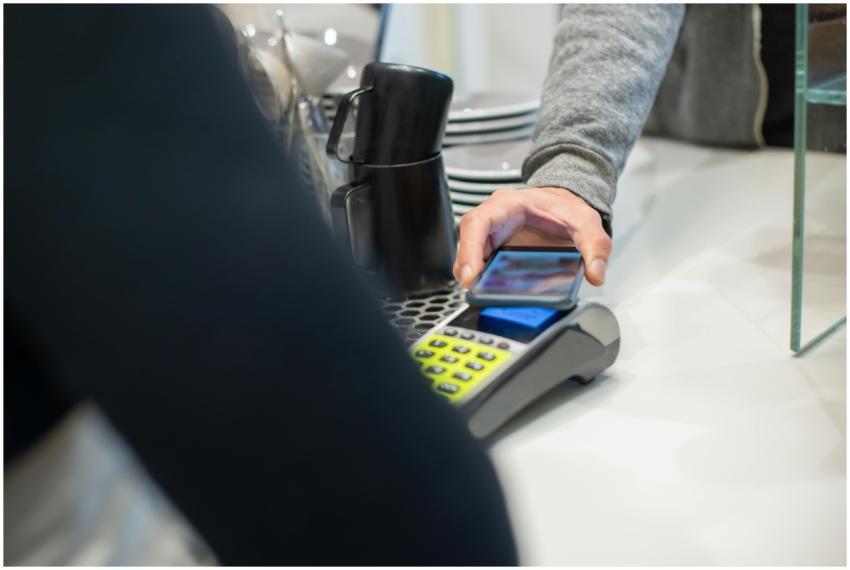 A customer makes a contactless payment using a sma