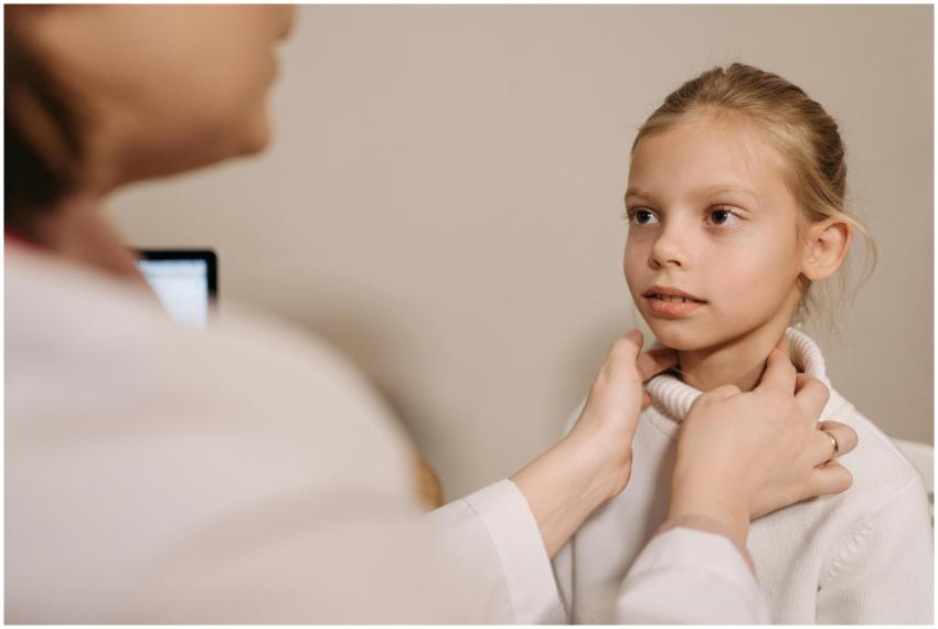 A doctor performing a medical check on a child dur
