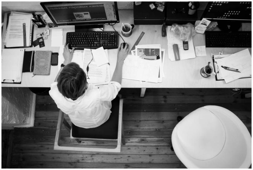 Black and white image of an employee working at a