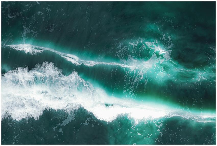 From above of turquoise water of ocean with white