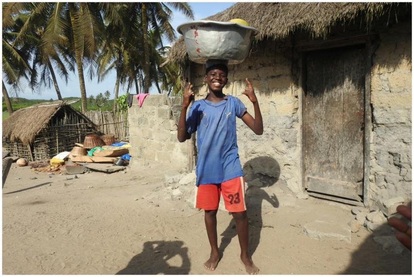 Young Boy Balancing Basket