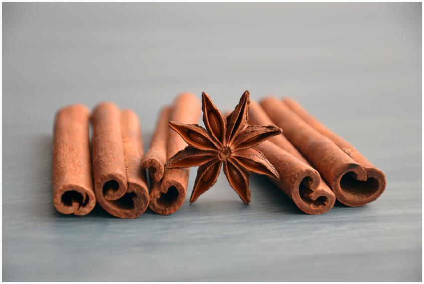 Cinnamon sticks and star anise on a wooden surface