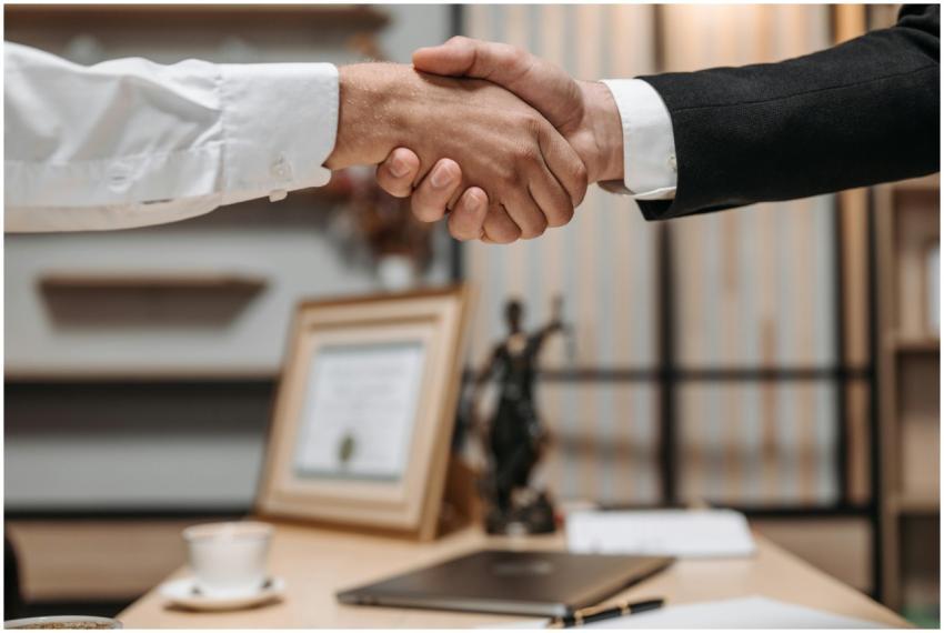 Close-up of a handshake between two professionals
