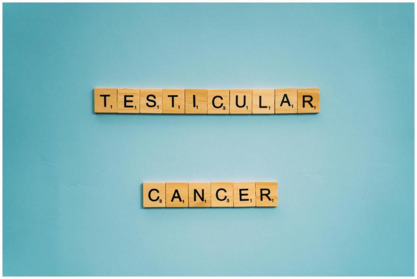 Wooden letter tiles spelling testicular cancer on