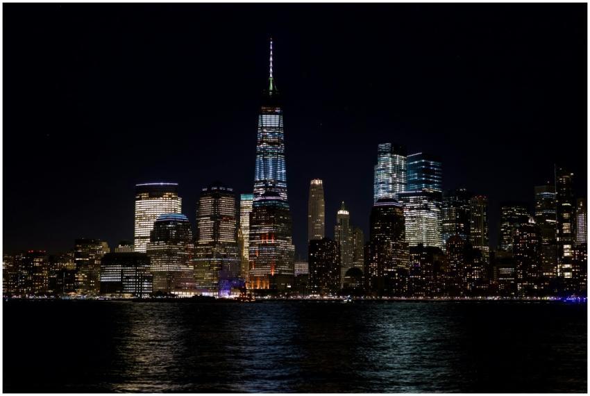 Illuminated skyline of New York City with iconic s