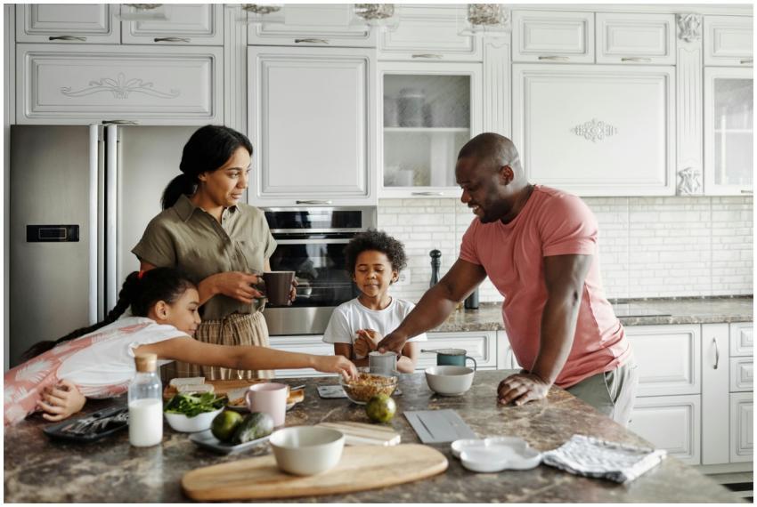 A happy family having breakfast together in their