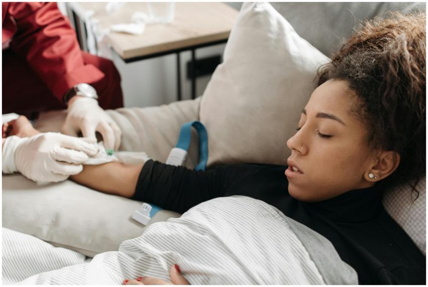 Paramedic providing medical care to an ill woman r