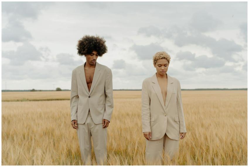 Stylish models in beige suits posing in a serene w