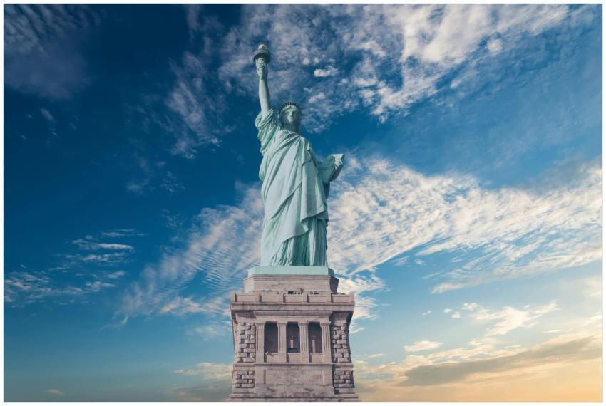 Iconic Statue of Liberty with a backdrop of a vibr