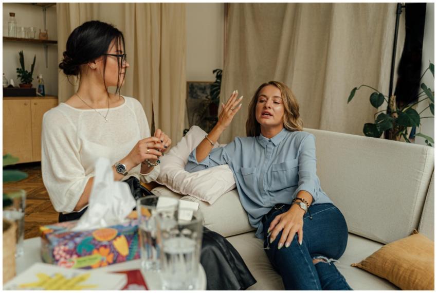 A counseling session with two women engaged in con