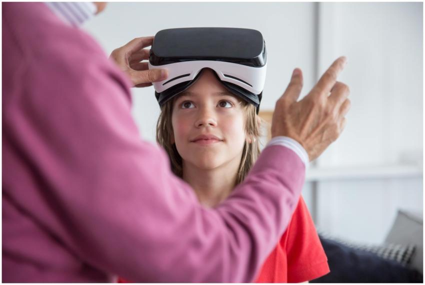 A young girl trying virtual reality goggles for th