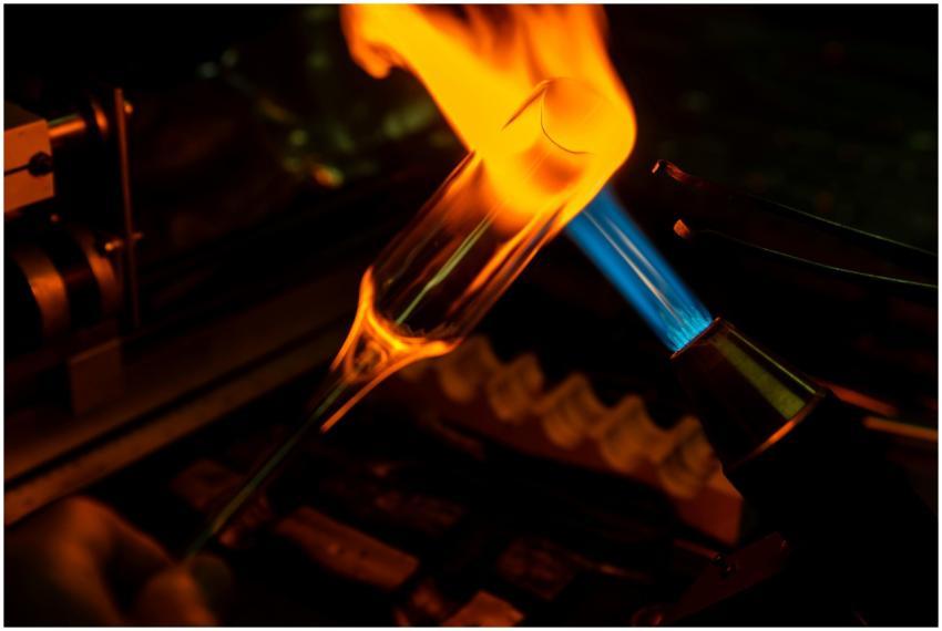 A close-up photograph of the glassblowing process